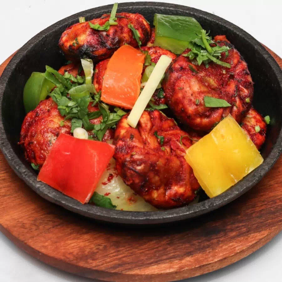 Award-winning sizzling halal chicken momo platter served at Taste of Himalayan Nepalese & Indian Restaurant in Rowley Regis, Blackheath near Birmingham